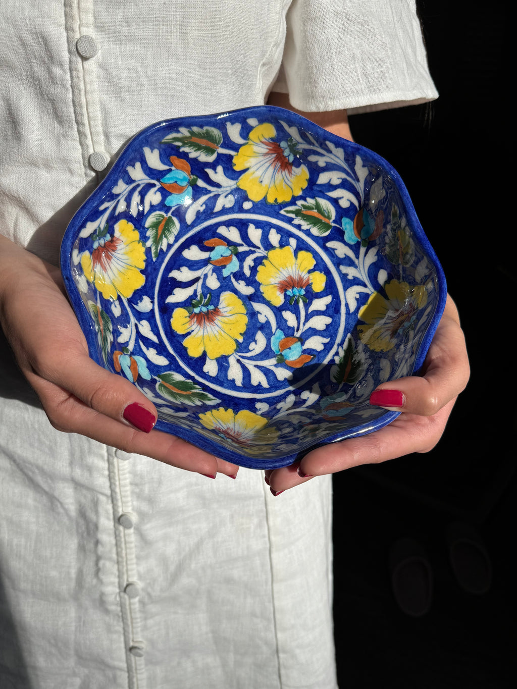 Handcrafted Jaipur blue pottery bowl with traditional painted pattern, side view